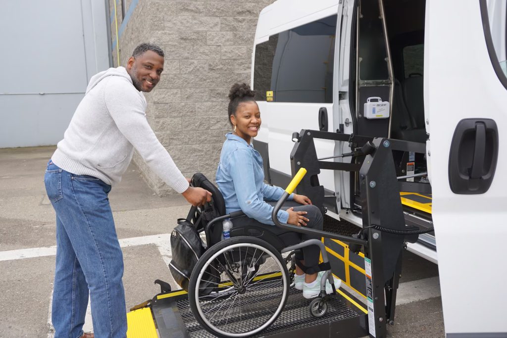 Girl on wheelchair entering a van